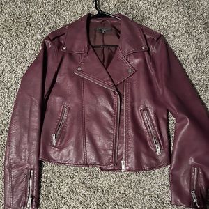 Maroon faux leather jacket.